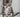 Kitten sat on a ledge licking its lips
